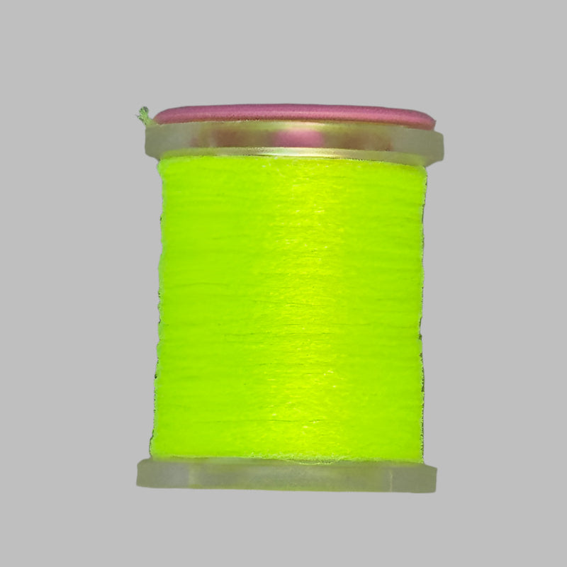 Bright yellow Antron yarn spool with clear plastic rim and end caps