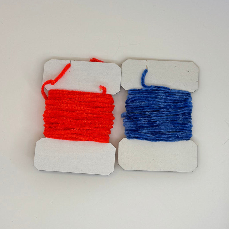 Chenille yarn spools, red and blue, on white display cards with hanging loops
