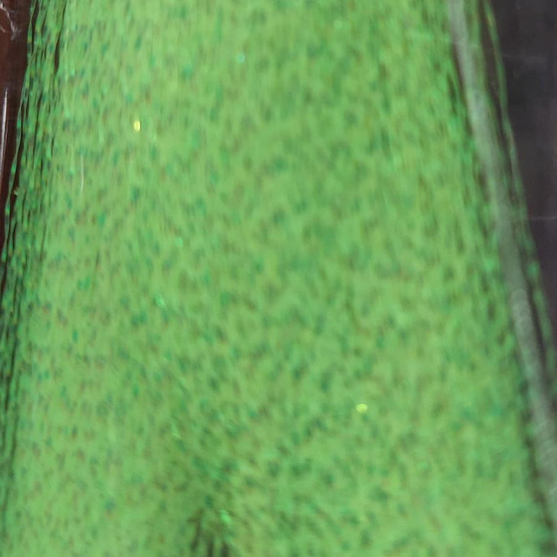 Lime green sparkly tinsel fibers with glitter flecks