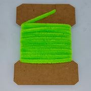 Medium rayon chenille yarn spool in bright green with ribbed fuzzy texture