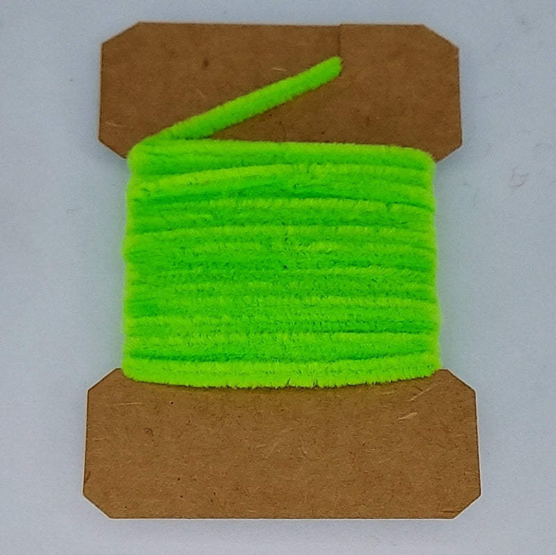 Medium rayon chenille yarn spool in bright green with ribbed fuzzy texture