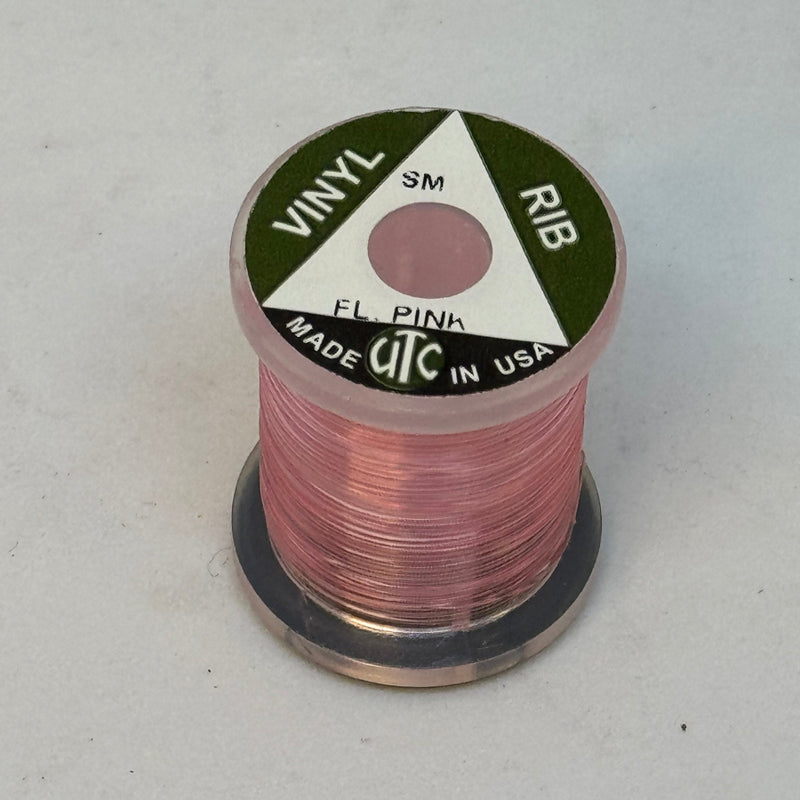 Vinyl D-rib spool of Fl. Pink vinyl trim, wound on a small reel