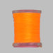 Close up spool of fluorescent orange Antron yarn