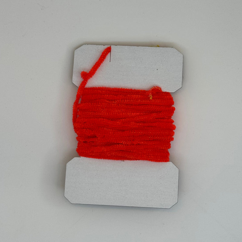 Red chenille yarn spool on white display card with hanging loop