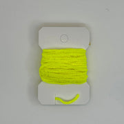 Chenille thread spool on card in fluorescent yellow with short yarn tail