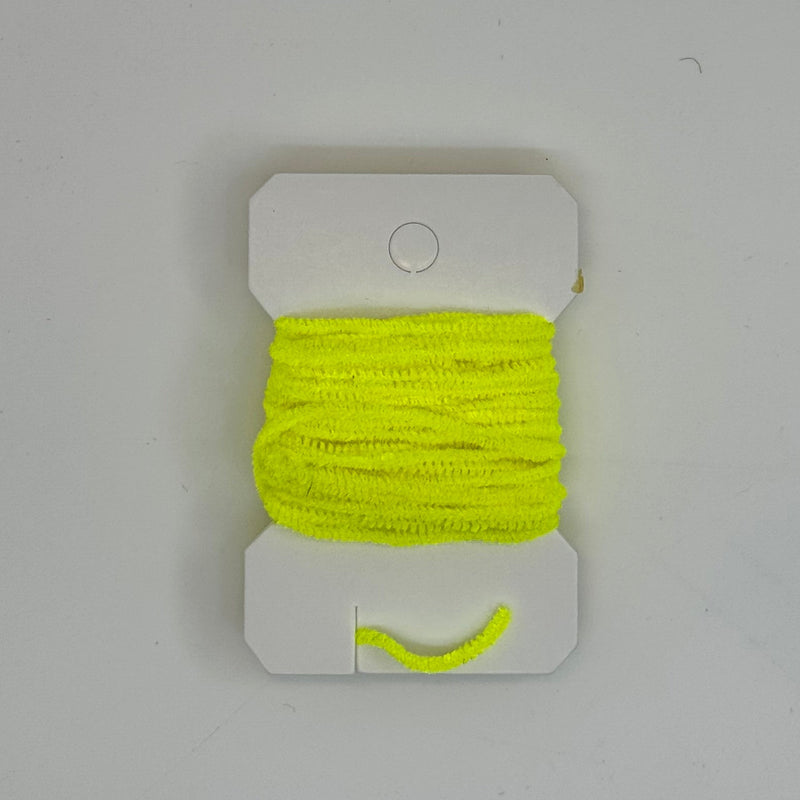 Chenille thread spool on card in fluorescent yellow with short yarn tail