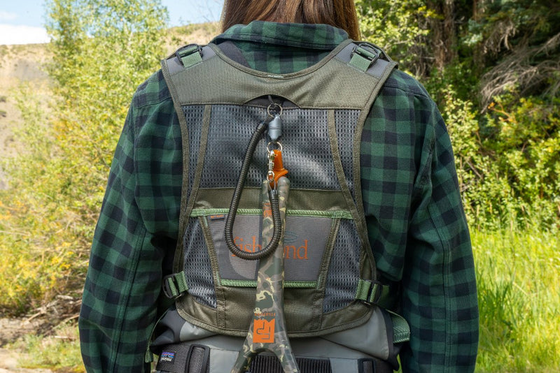 Fly fishing vest back view with taupe mesh panel, green trim, large zip pocket and carrying straps