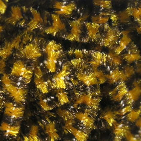 Stonefly chenille in gold and dark bronze fibers, close-up