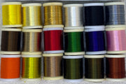 Four-strand floss spools assortment in assorted colors, including yellow and dark blue