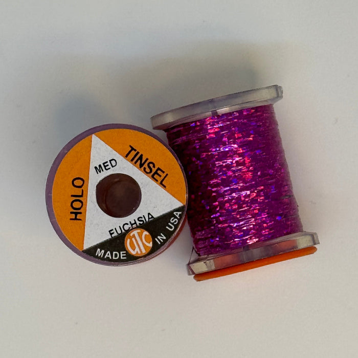 2 Spools of Fuchsia Tinsel from two angles, one with label showing
