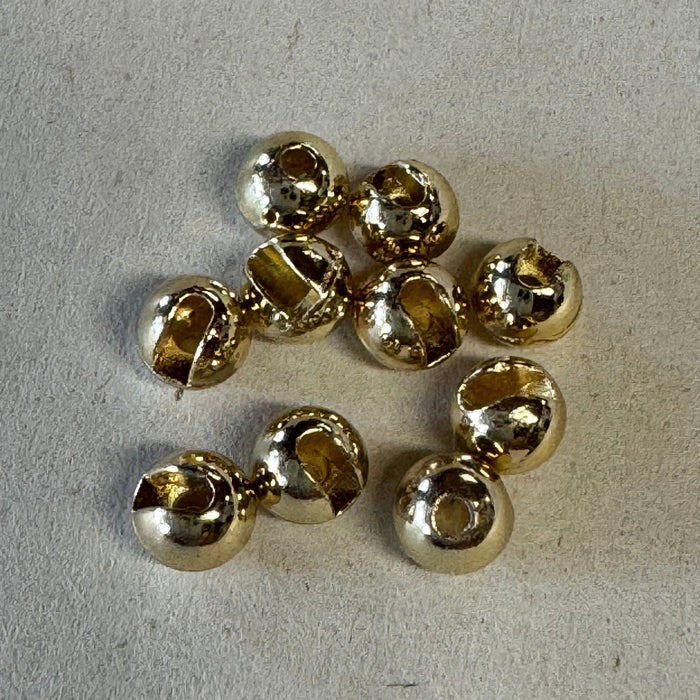 pile of 10 gold colored slotted tungsten beads