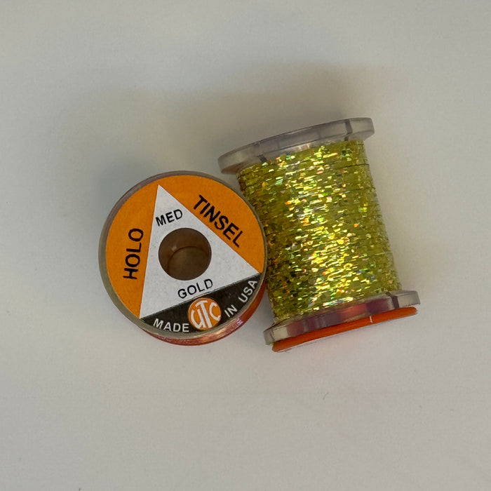 2 Spools of Gold Tinsel from two angles, one with label showing