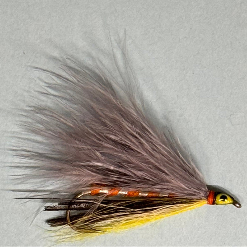 Marabou fishing lure with gray-brown feather tail and yellow-orange body
