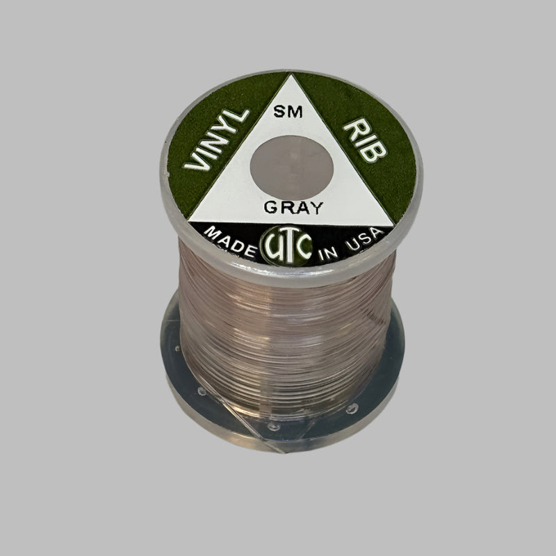 Spool of vinyl rib trim in gray with coiled strand