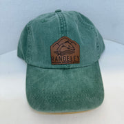 Green washed baseball cap with brown leather patch logo on front