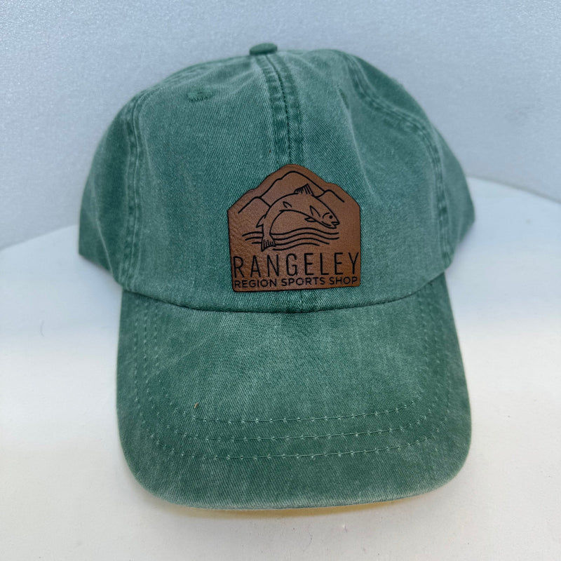 Green washed baseball cap with brown leather patch logo on front