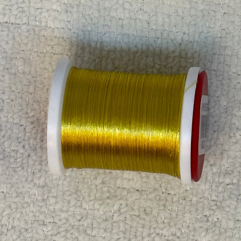 Spool of 70 denier thread in bright yellow-green with red side flanges