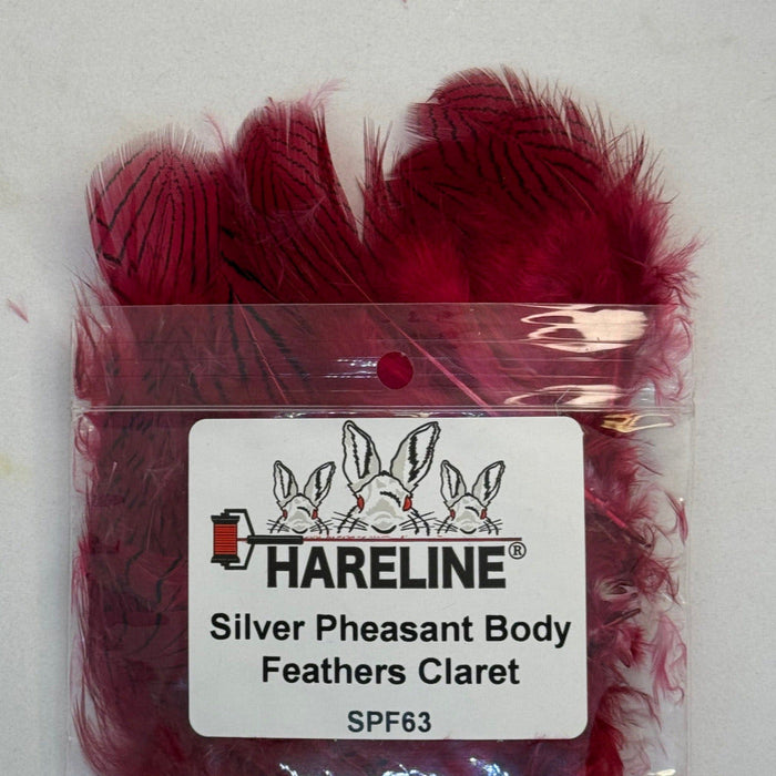 Claret feathers coming out of plastic product bag