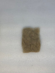 Taupe-brown dubbing fibers clump