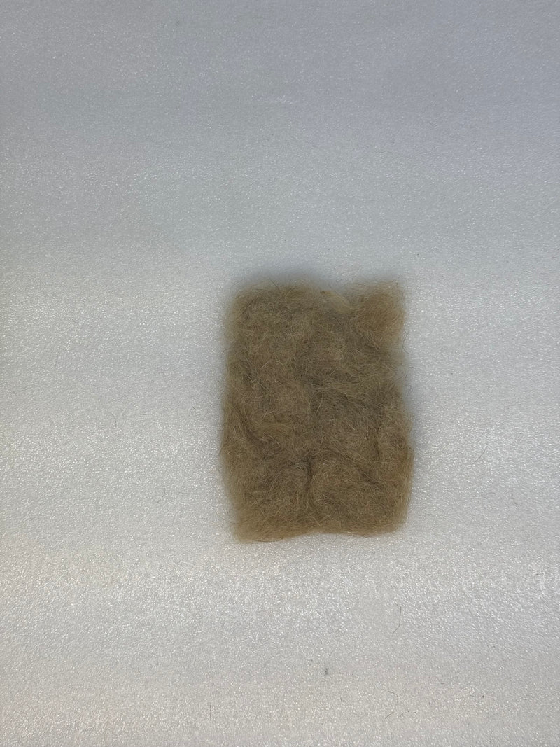 Taupe-brown dubbing fibers clump