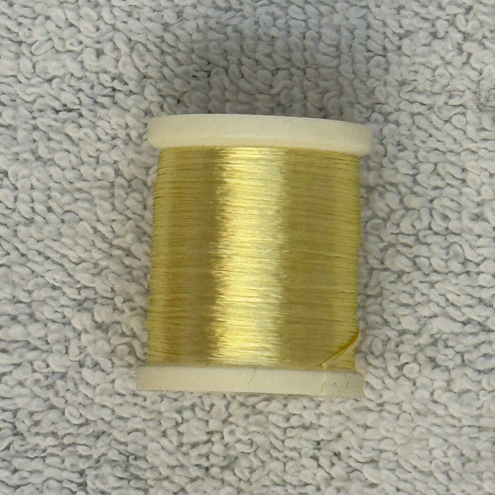 Spool of light yellow cream 4 strand