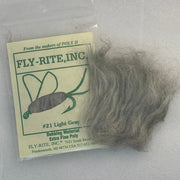 Light gray dubbing material fibers in a clear bag with label