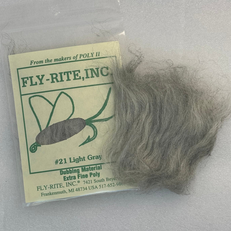 Light gray dubbing material fibers in a clear bag with label