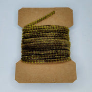 Medium variegated chenille yarn spool, olive green and brown striped texture