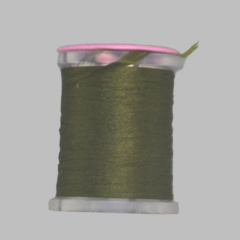 Dark olive Antron yarn spool with clear plastic rim and end caps