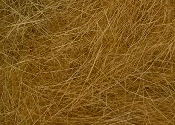 Extreme close up of light brown dubbin
