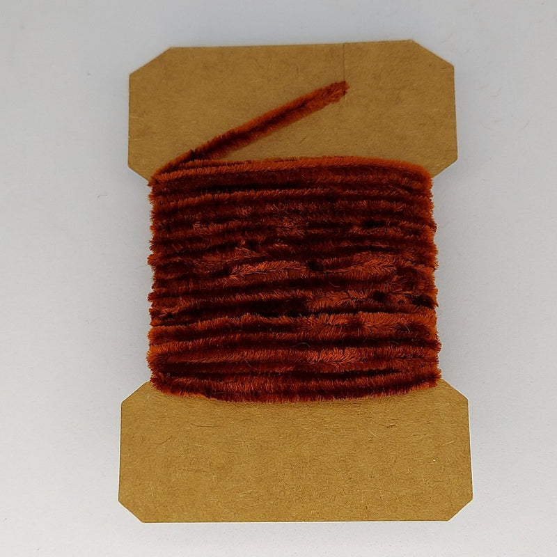 Medium rayon chenille yarn spool in dark brown with ribbed fuzzy texture