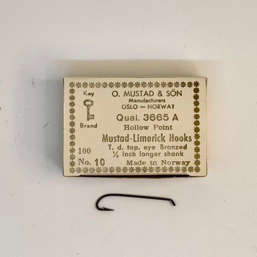 Size 10 box of Mustad hook with one hook below the box