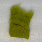 Bright green dubbing fibers clump