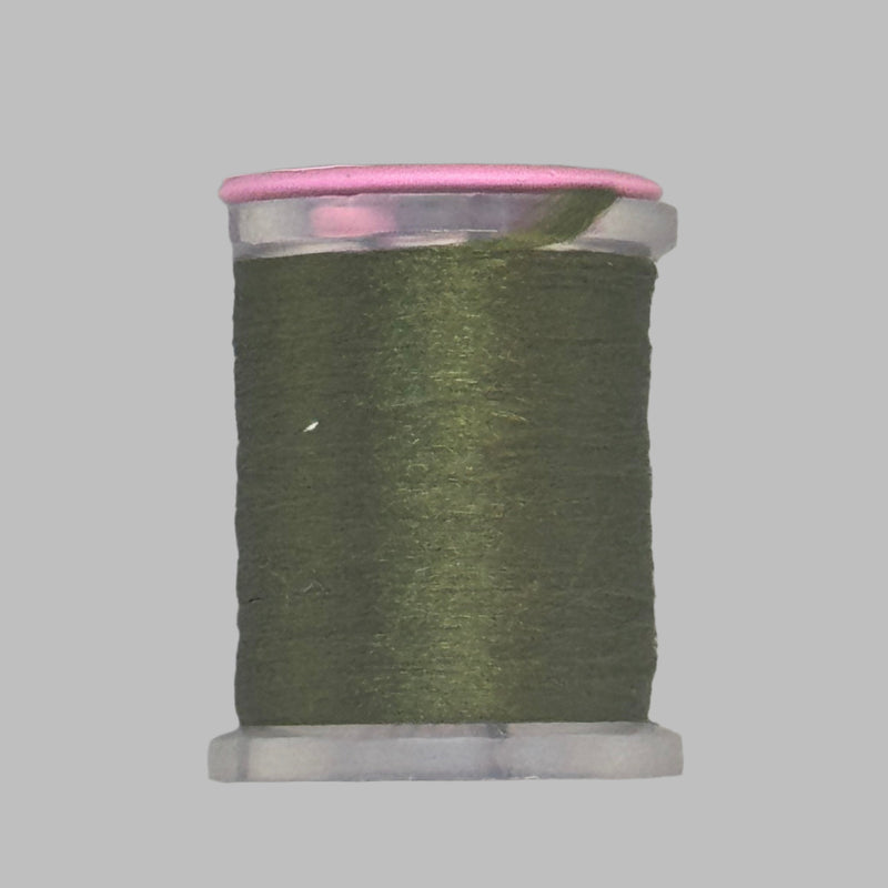 Dark green Antron yarn spool with clear plastic rim and end caps