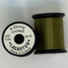 Spools of olive thread from two angles side by side