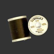 Waxed flymaster plus thread spool in dark olive brown, with printed label