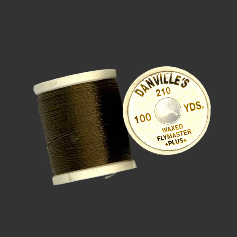 Waxed flymaster plus thread spool in dark olive brown, with printed label
