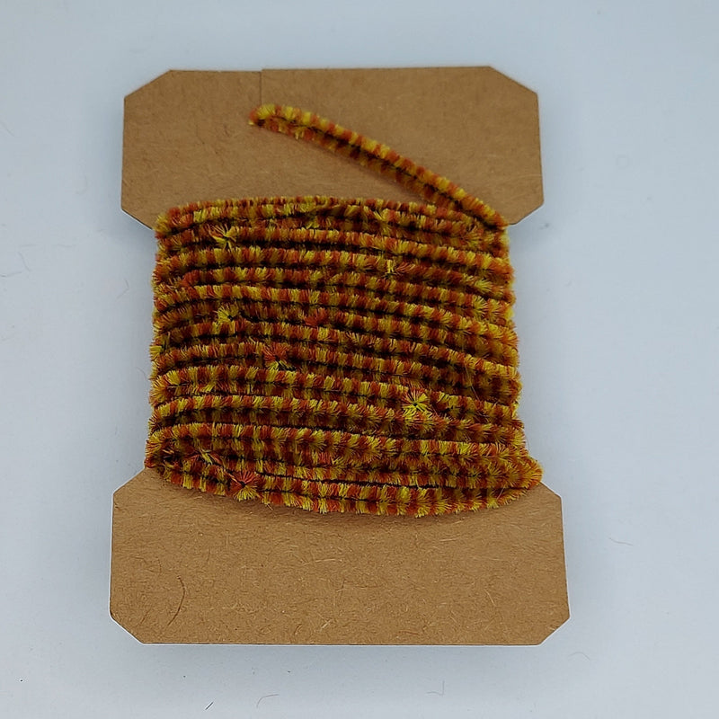 Medium variegated chenille yarn spool, golden brown with green and red flecks