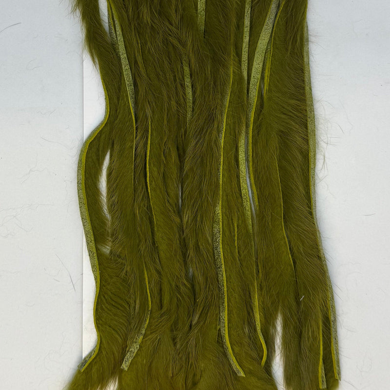 Rabbit half-skin fur hide close-up, zonked shag, olive