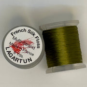 French silk floss spool with tightly wound olive green thread