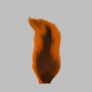 Medium bucktail tuft, orange with dark center