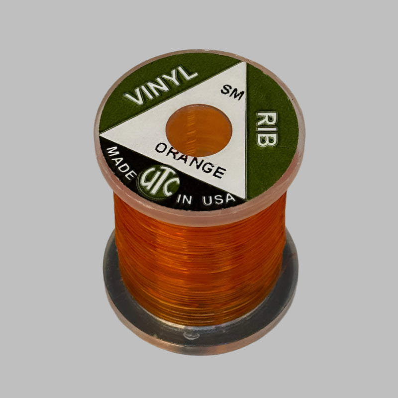 Spool of vinyl rib trim in orange with coiled strand