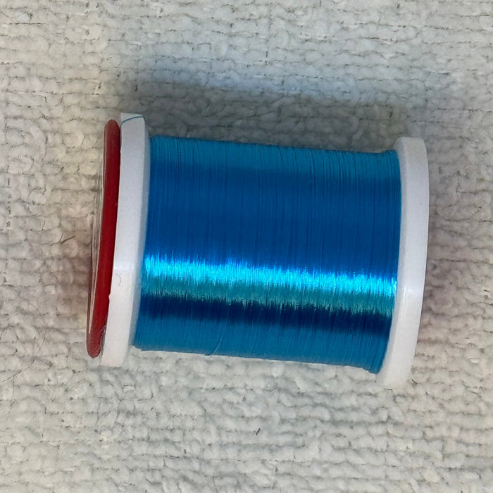 Close up spool of PEACOCK BLUE ultra thread