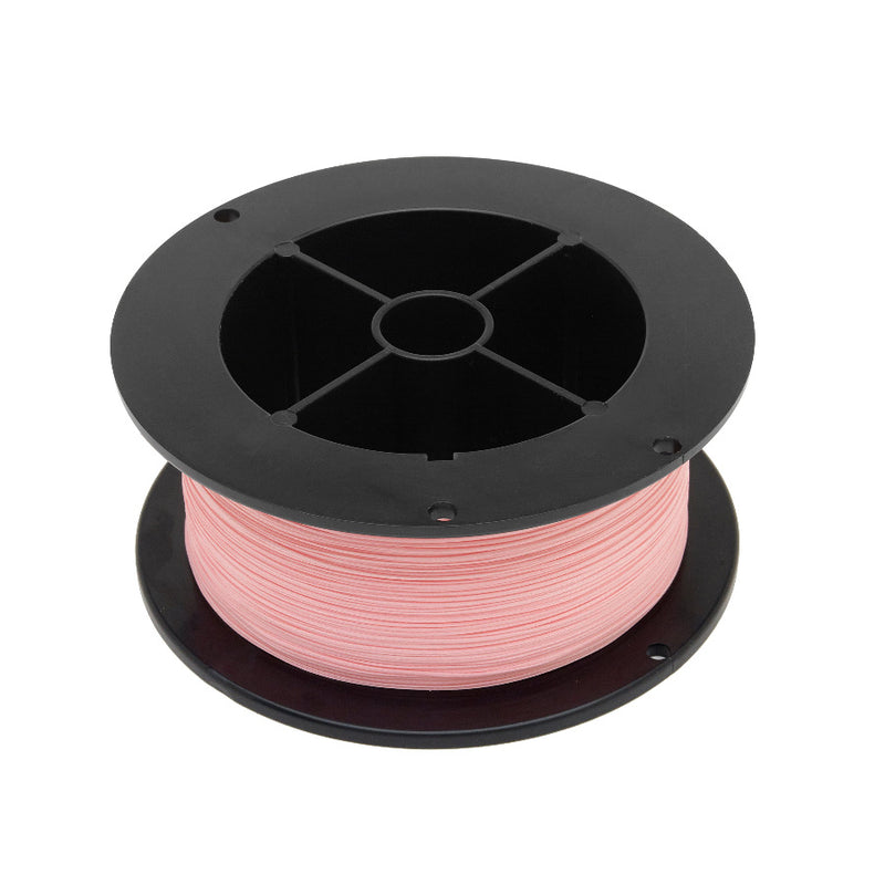 Fly line backing spool with light pink line wound on black reel