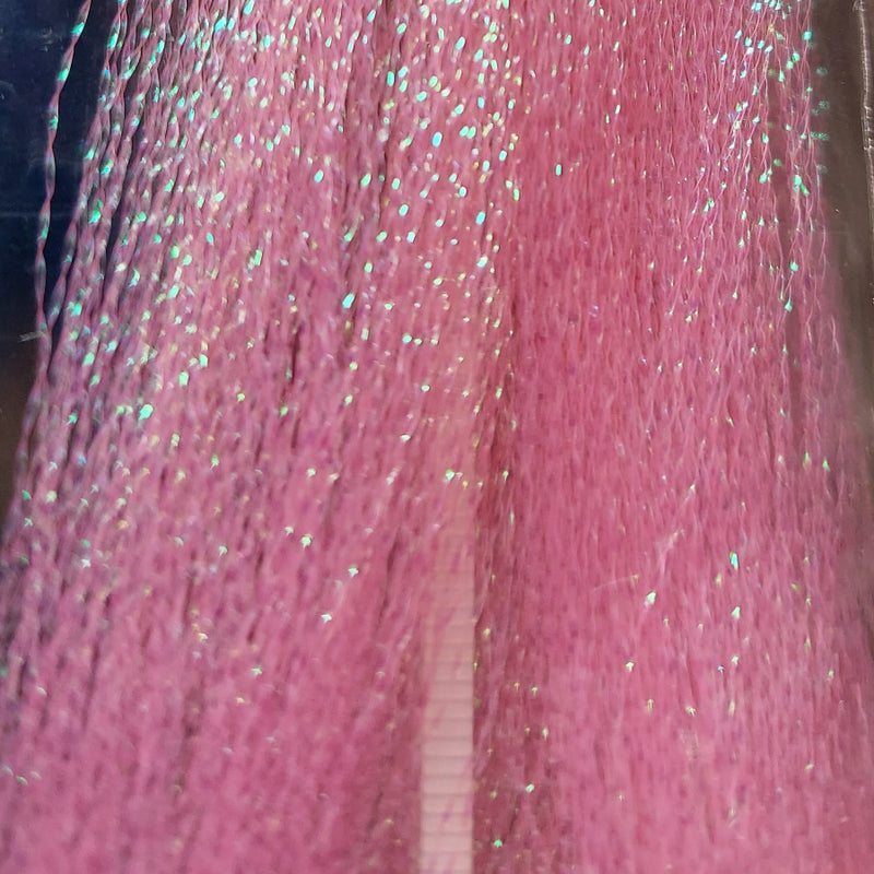 Pink sparkly tinsel fibers with silver glitter flecks