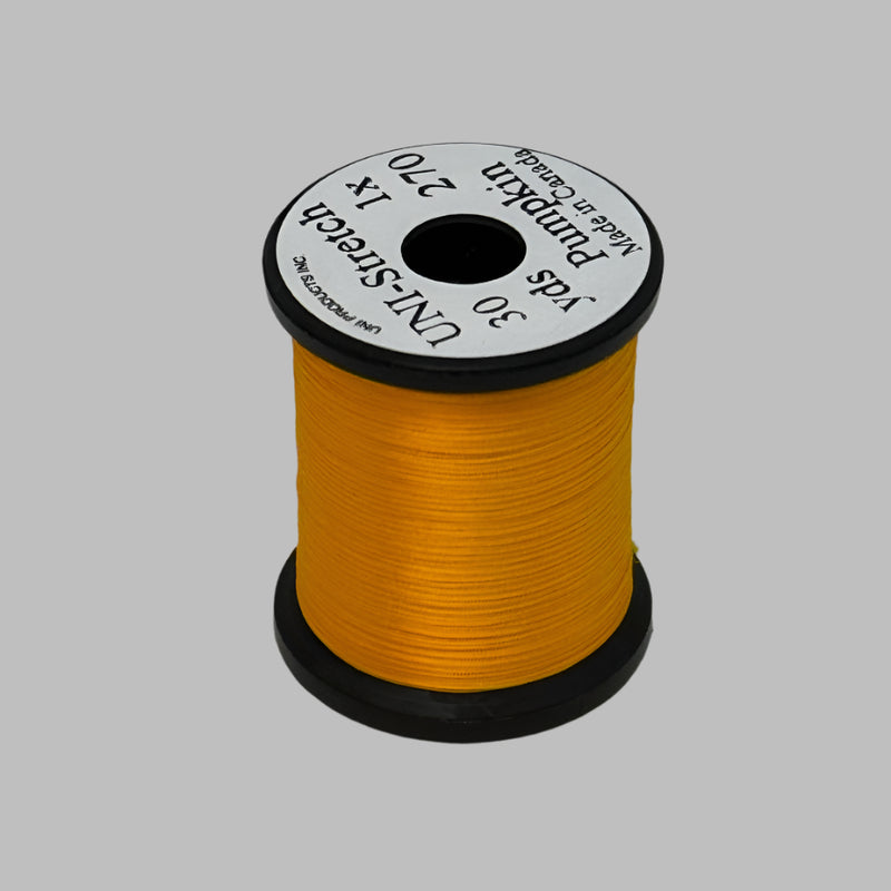 Orange-gold stretch thread spool with label, 30 yd