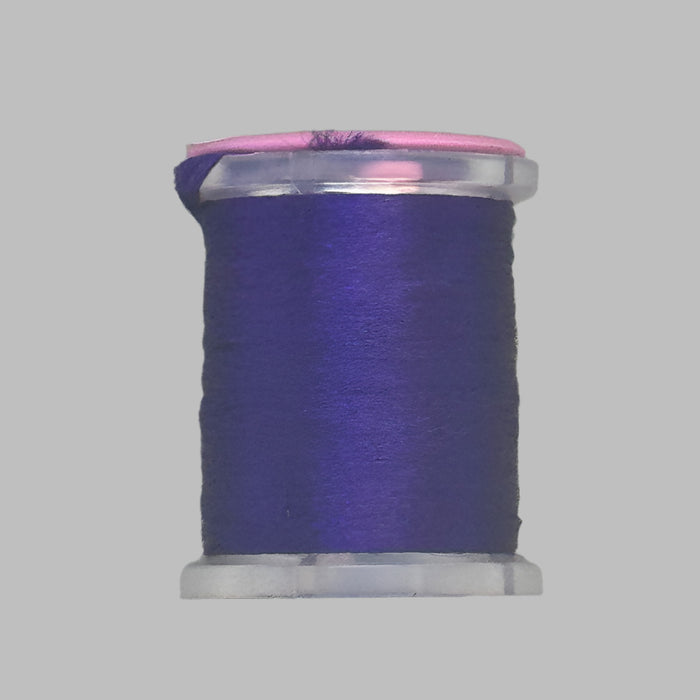 close up spool of purple Antron yarn