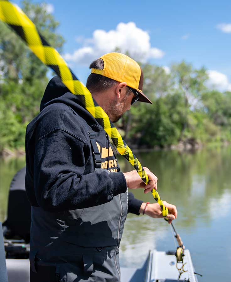 Loon Quickdraw rod sleeve with yellow and black stripes on fishing rod