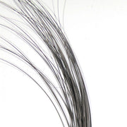 Quill body fly with dark gray feather fibers, curved strand bundle