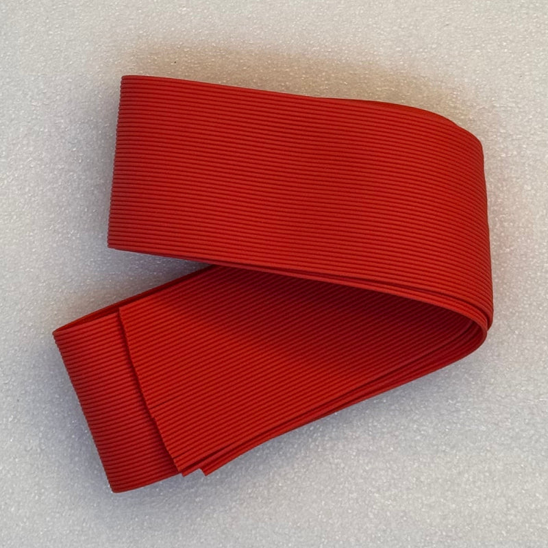 Round rubber strip, solid red ribbed texture in folded roll